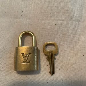 Louis Vuitton small lock, and key